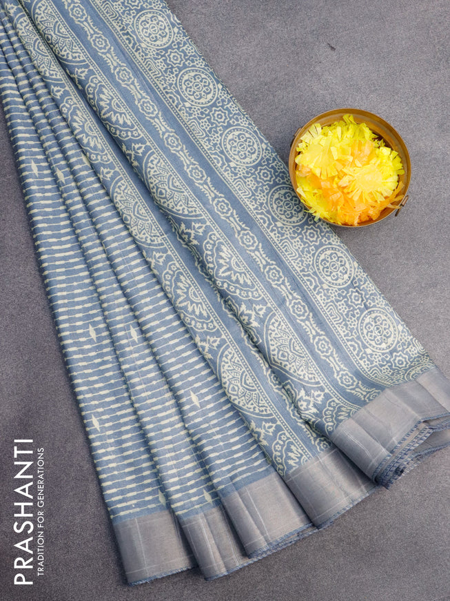 Semi tussar saree bluish grey with allover prints and zari woven border