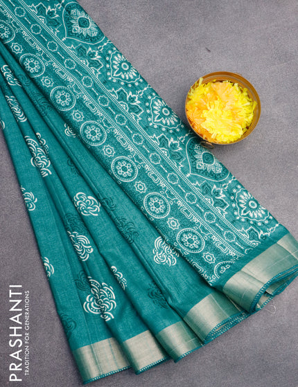 Semi tussar saree teal green shade with allover prints and zari woven border