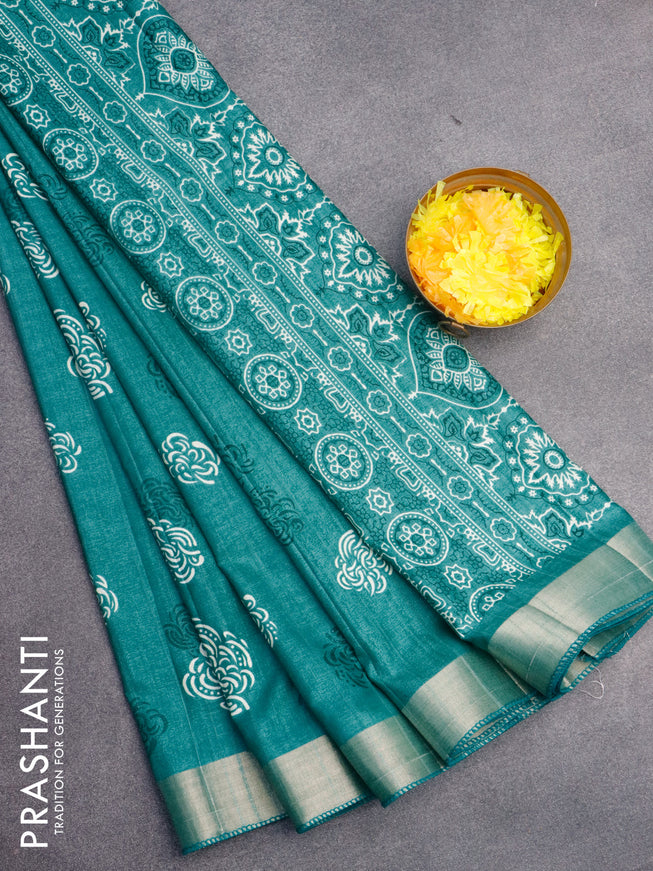 Semi tussar saree teal green shade with allover prints and zari woven border