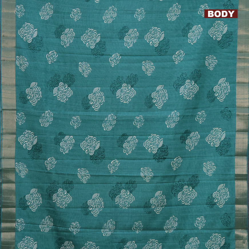 Semi tussar saree teal green shade with allover prints and zari woven border