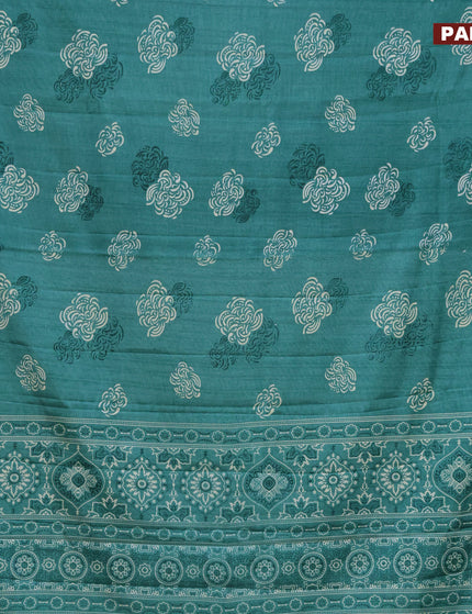 Semi tussar saree teal green shade with allover prints and zari woven border