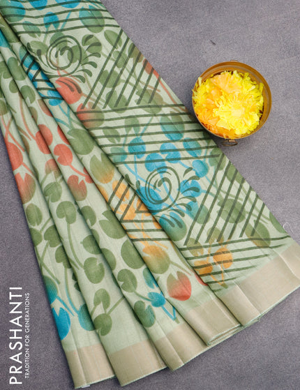 Semi tussar saree pastel green with allover prints and zari woven border