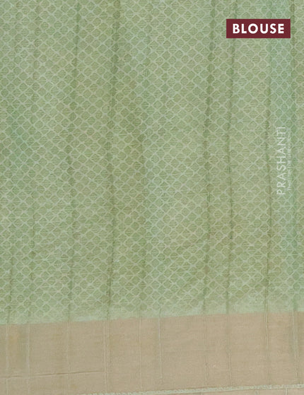 Semi tussar saree pastel green with allover prints and zari woven border