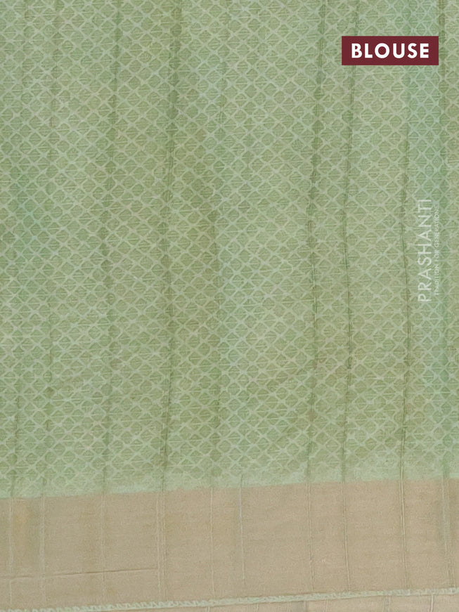 Semi tussar saree pastel green with allover prints and zari woven border