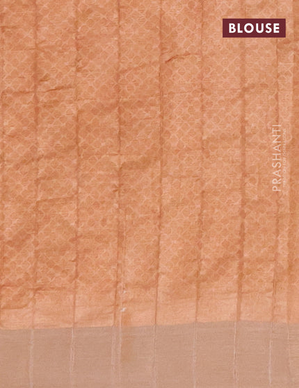 Semi tussar saree pastel peach shade with allover prints and zari woven border