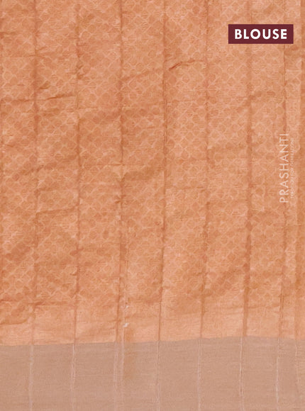 Semi tussar saree pastel peach shade with allover prints and zari woven border