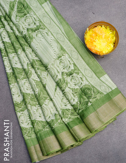 Semi tussar saree green shade with allover prints and zari woven border