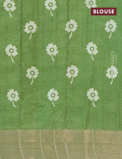 Semi tussar saree green shade with allover prints and zari woven border