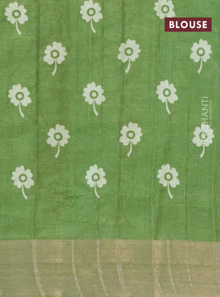 Semi tussar saree green shade with allover prints and zari woven border