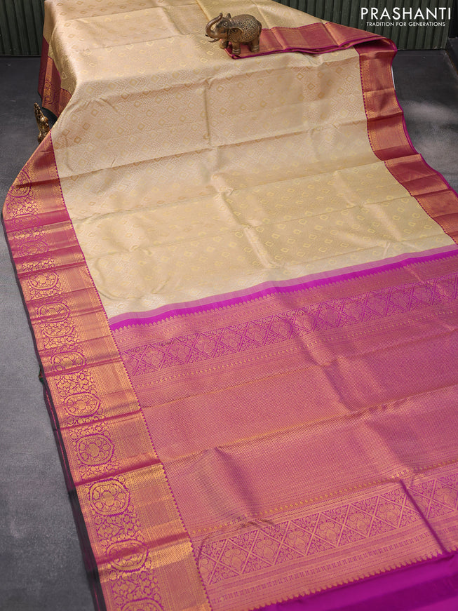 Pure kanjivaram silk saree beige and purple with allover silver zari woven brocade weaves and rich zari woven floral border