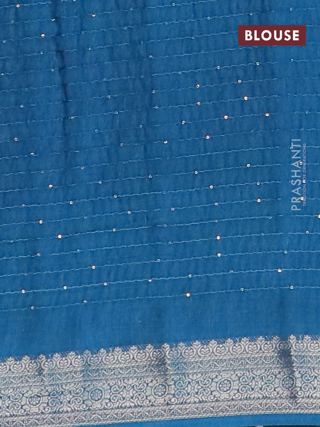 Semi raw silk saree cs blue with allover floral digital prints & sequin work and zari woven border