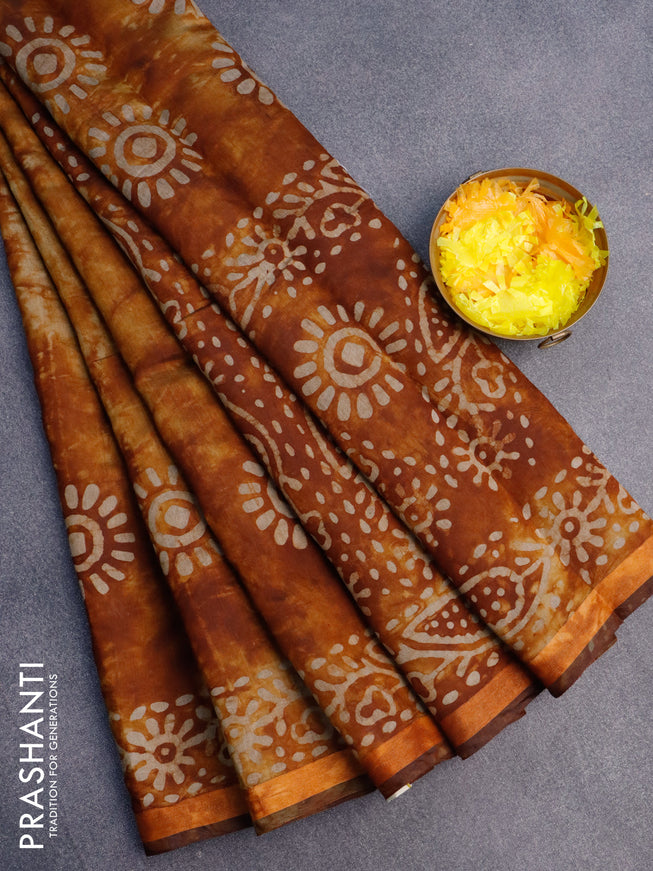 Muslin cotton saree dark mustard with tie and dye & batik butta prints and small zari woven border