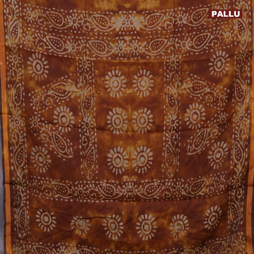 Muslin cotton saree dark mustard with tie and dye & batik butta prints and small zari woven border