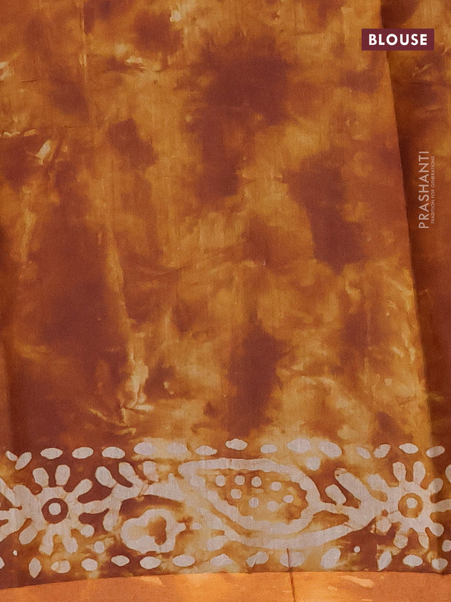 Muslin cotton saree dark mustard with tie and dye & batik butta prints and small zari woven border