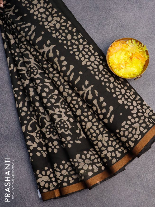 Muslin cotton saree black with allover batik prints and small zari woven border