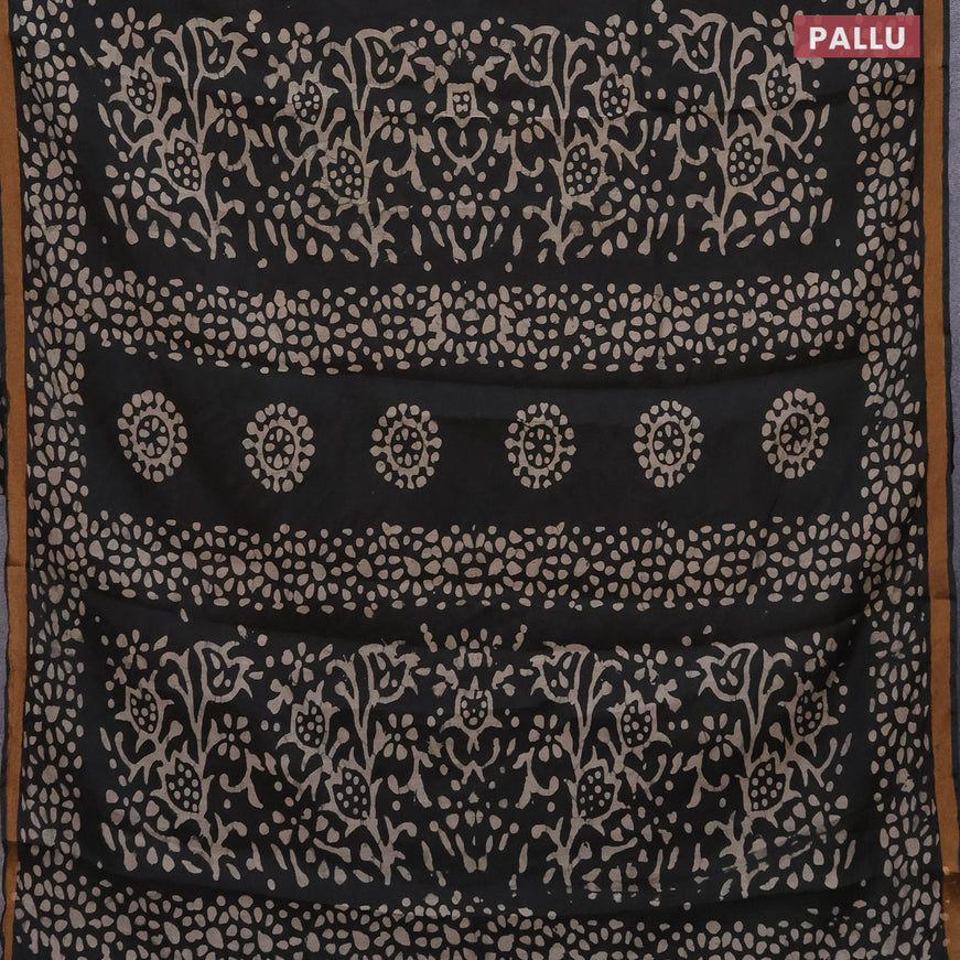 Muslin cotton saree black with allover batik prints and small zari woven border