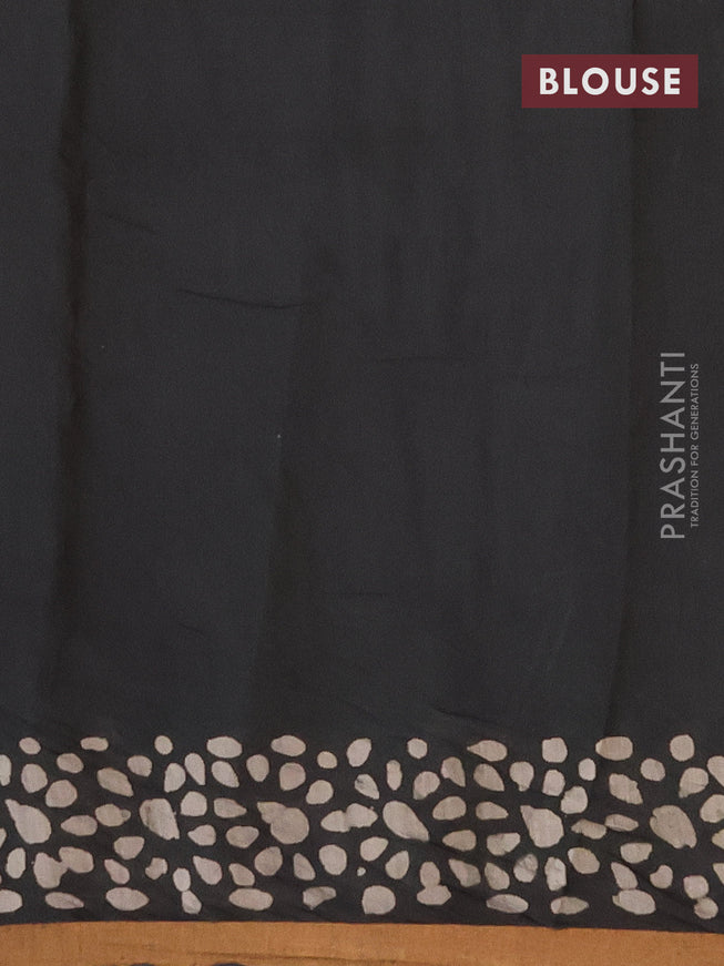 Muslin cotton saree black with allover batik prints and small zari woven border