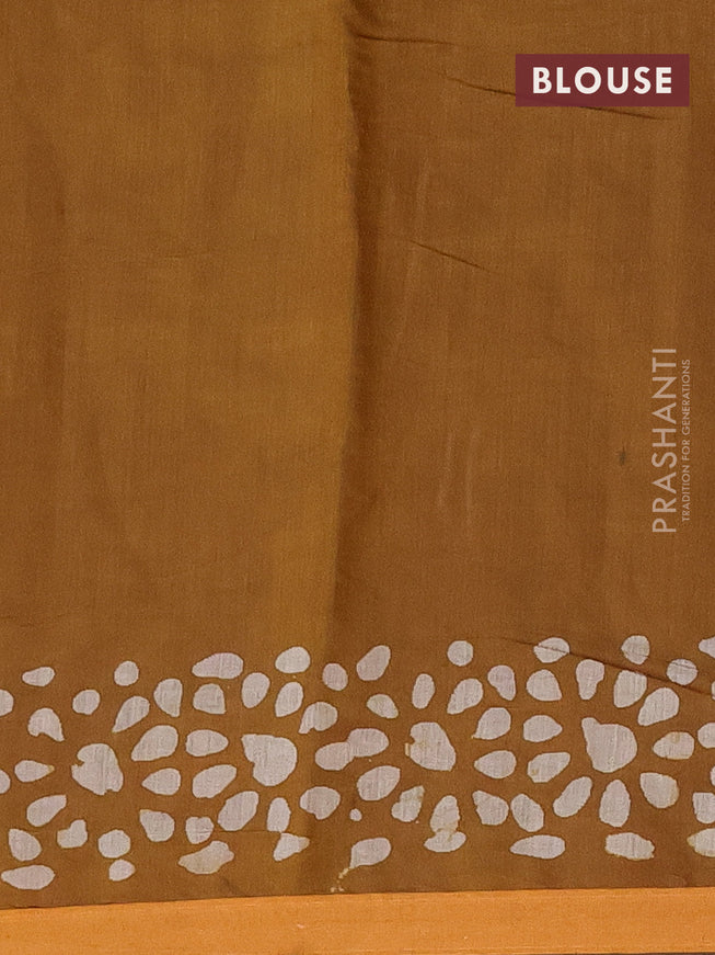 Muslin cotton saree dark mustard with allover batik prints and small zari woven border