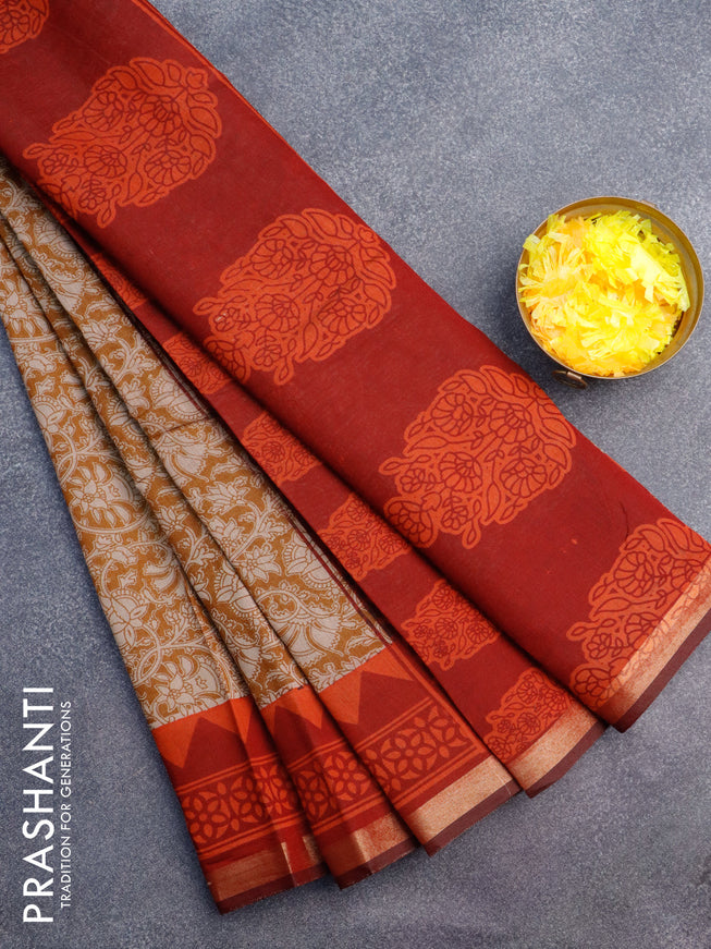 Muslin cotton saree dark mustard and rustic orange with allover floral prints and small zari woven border