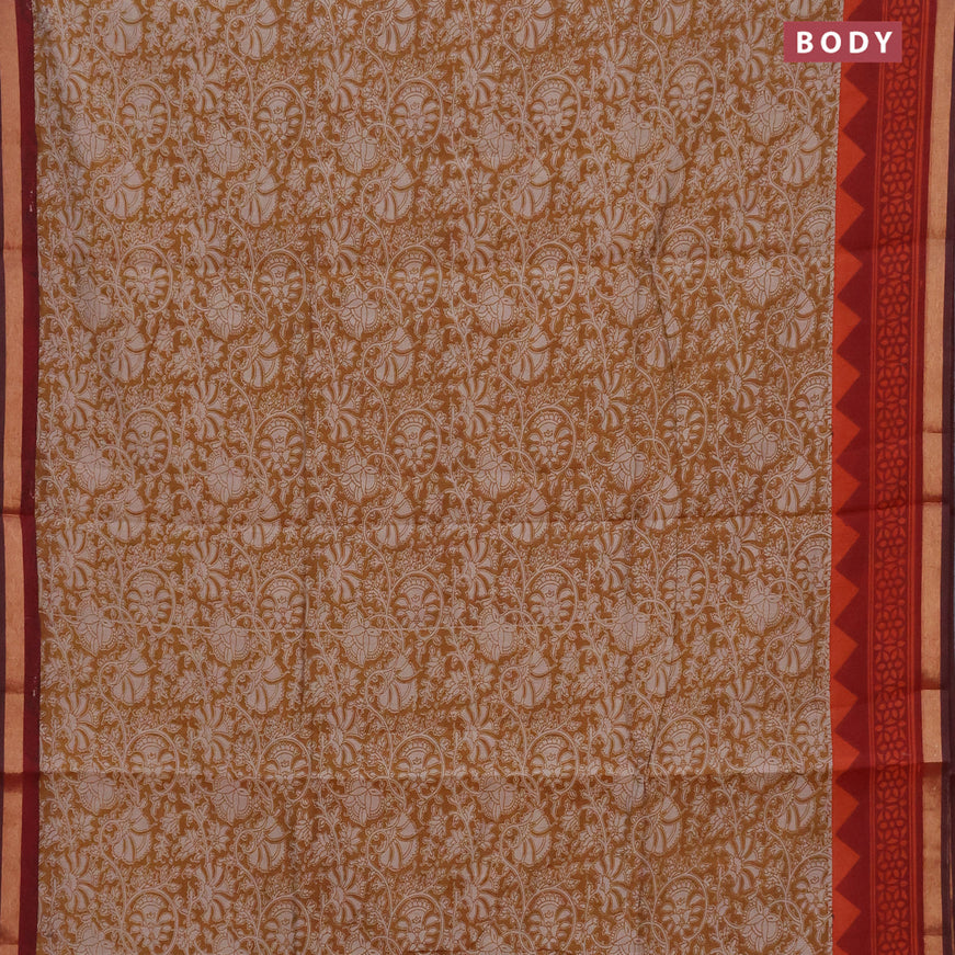 Muslin cotton saree dark mustard and rustic orange with allover floral prints and small zari woven border