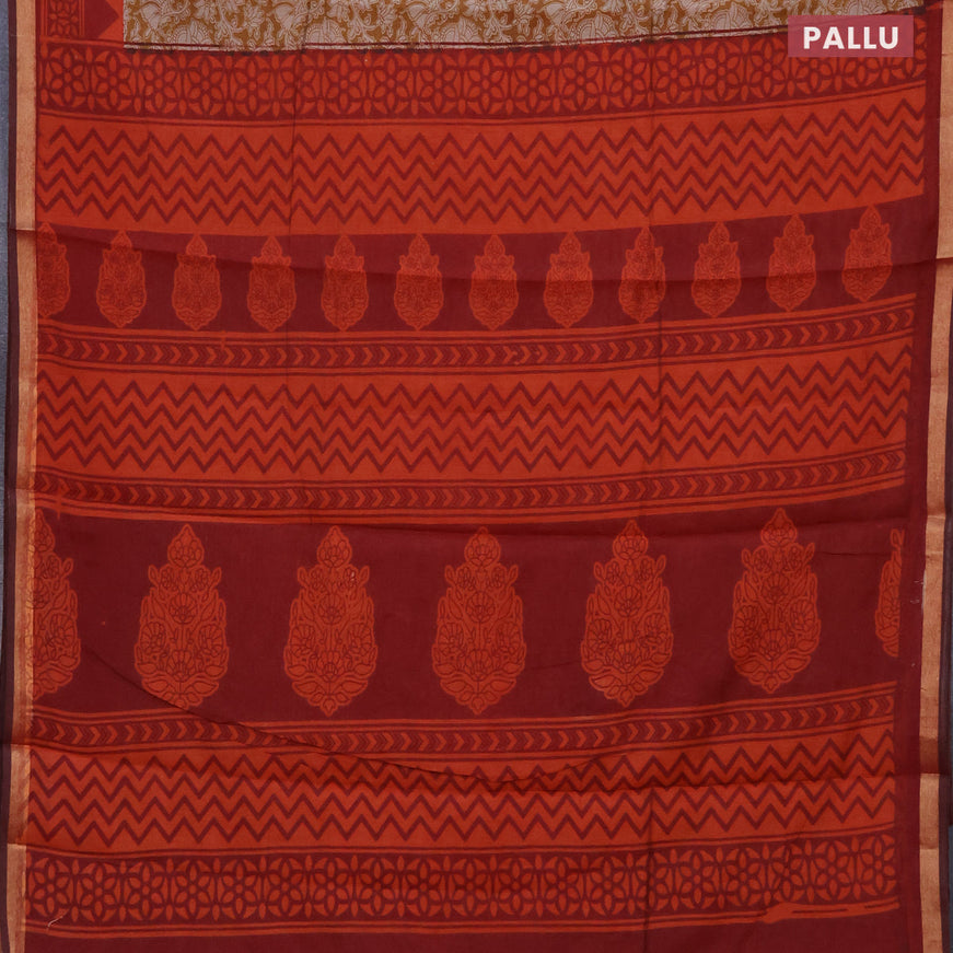 Muslin cotton saree dark mustard and rustic orange with allover floral prints and small zari woven border