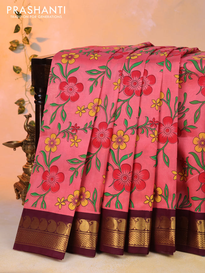 Silk cotton saree peach pink and wine shade with allover floral prints and paisley zari woven korvai border