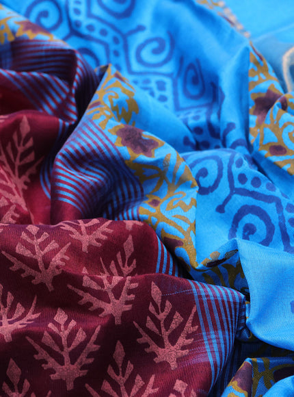 Silk cotton block printed saree maroon and cs blue with allover prints and zari woven border