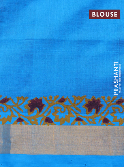 Silk cotton block printed saree maroon and cs blue with allover prints and zari woven border