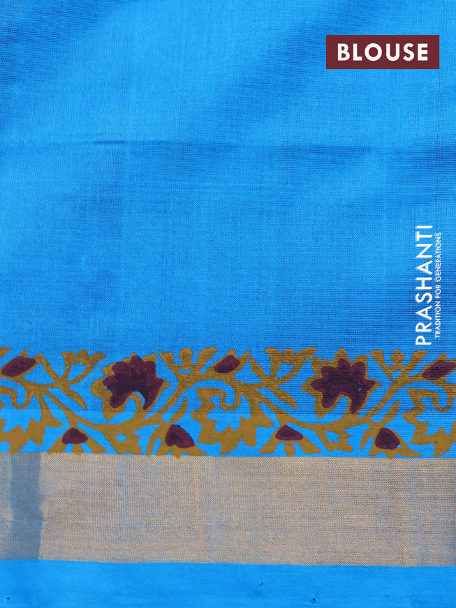 Silk cotton block printed saree maroon and cs blue with allover prints and zari woven border