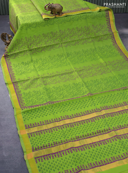 Silk cotton block printed saree light green with allover prints and zari woven border