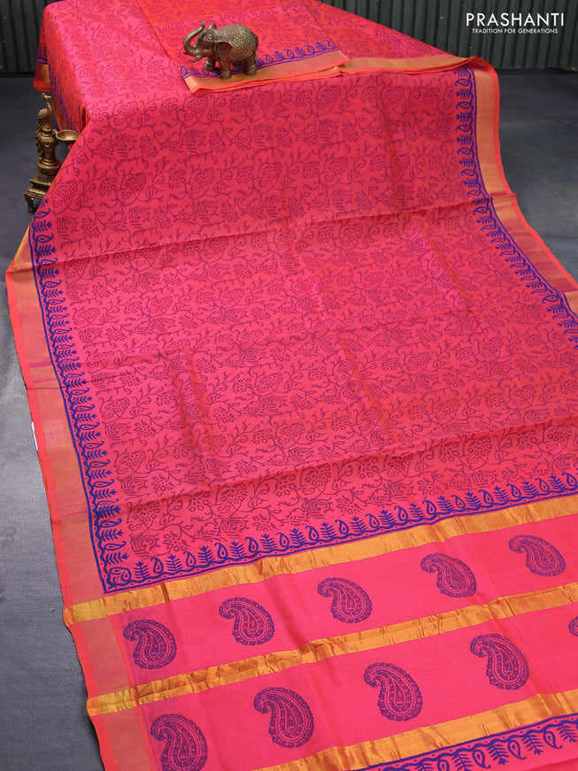 Silk cotton block printed saree dual shade of pinkish orange with allover prints and zari woven border