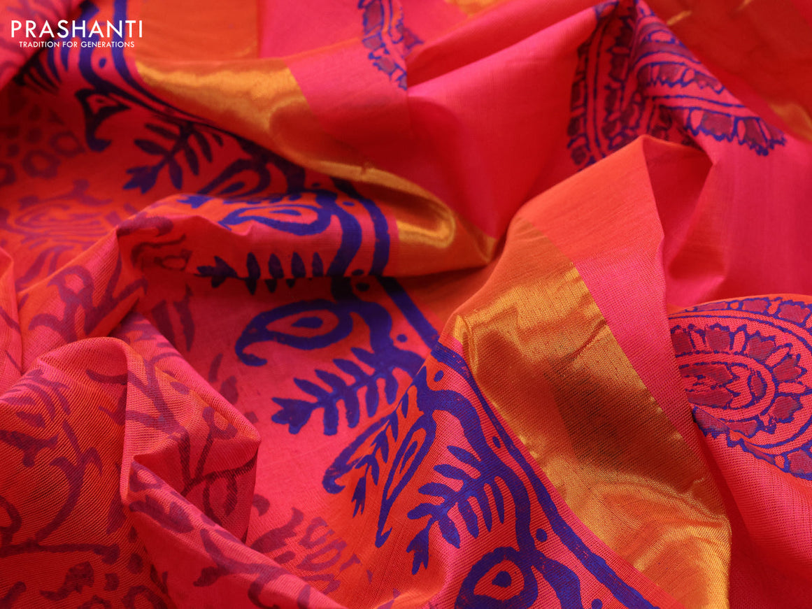 Silk cotton block printed saree dual shade of pinkish orange with allover prints and zari woven border