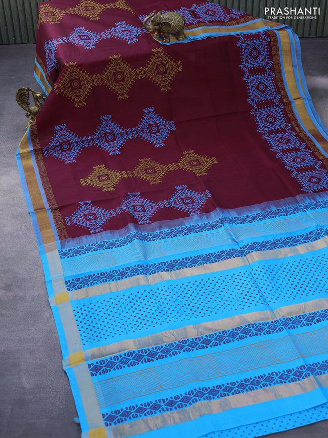 Silk cotton block printed saree maroon and light blue with allover prints and zari woven border