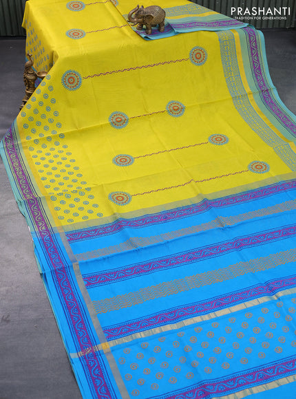 Silk cotton block printed saree lime yellow and cs blue with allover butta prints and zari woven simple border