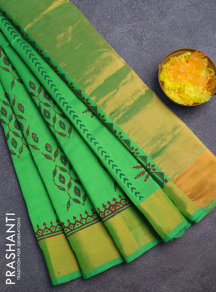 Silk cotton block printed saree green with allover prints and zari woven border