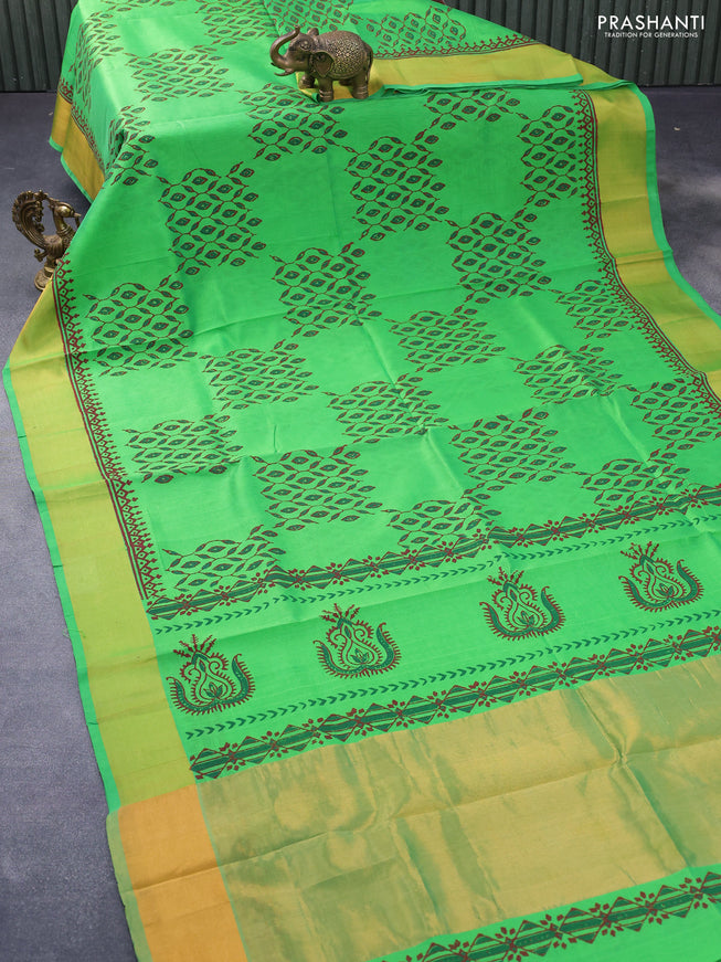 Silk cotton block printed saree green with allover prints and zari woven border