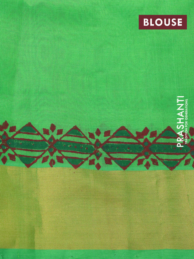 Silk cotton block printed saree green with allover prints and zari woven border