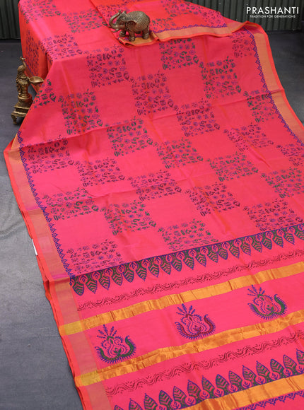 Silk cotton block printed saree dual shade of pinkish orange with allover prints and zari woven border