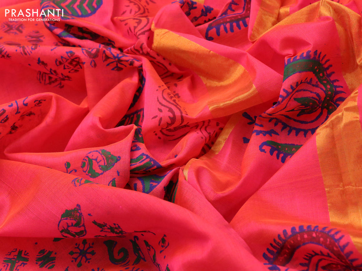 Silk cotton block printed saree dual shade of pinkish orange with allover prints and zari woven border