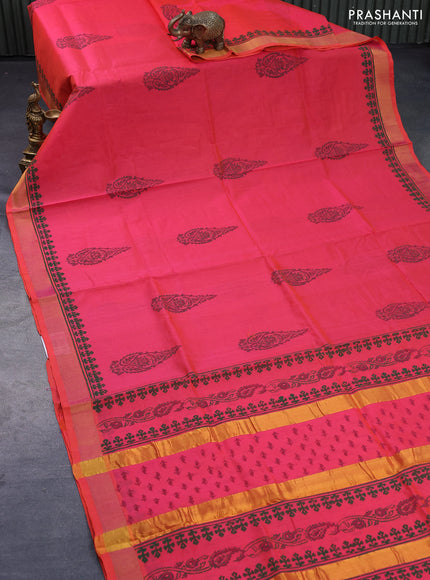 Silk cotton block printed saree dual shade of pinkish orange with butta print and zari woven border