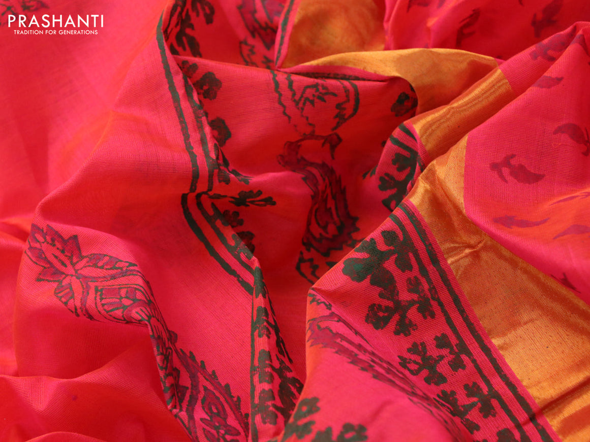 Silk cotton block printed saree dual shade of pinkish orange with butta print and zari woven border