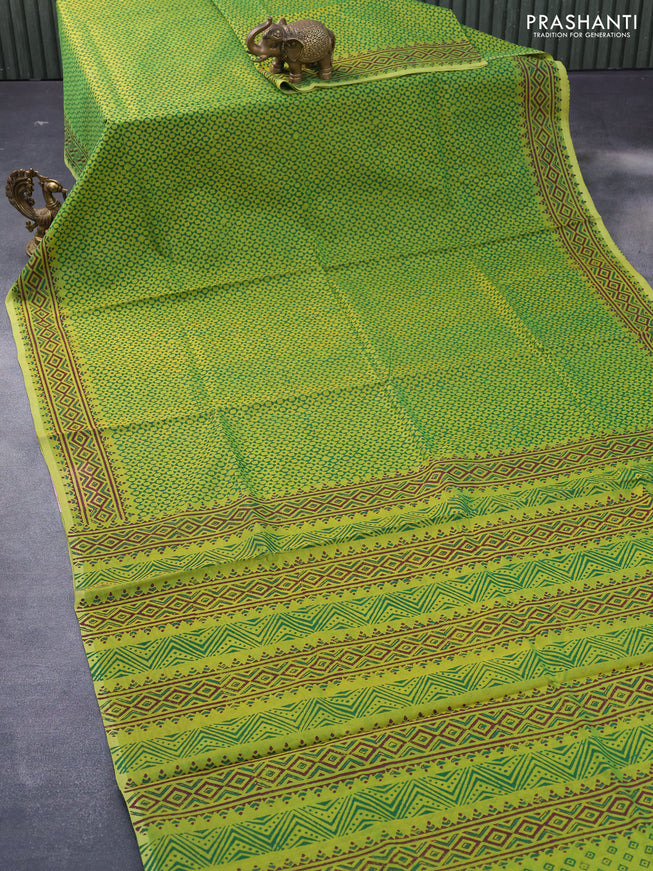 Silk cotton block printed saree light green with allover prints and printed border