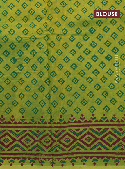 Silk cotton block printed saree light green with allover prints and printed border