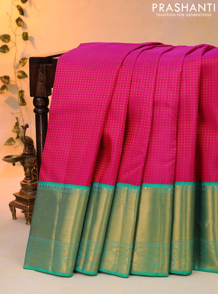 Pure kanjivaram silk saree pink and teal green with allover zari woven butta weaves and long zari woven korvai border