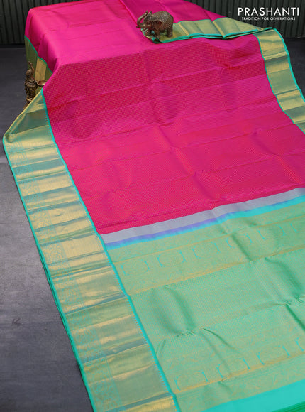 Pure kanjivaram silk saree pink and teal green with allover zari woven butta weaves and long zari woven korvai border