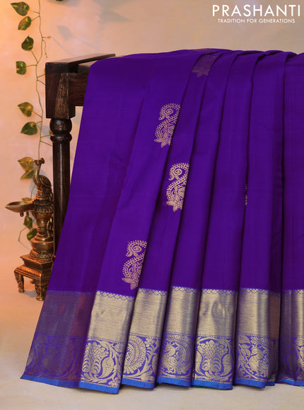 Pure kanjivaram silk saree violet and cs blue with zari woven paisley buttas and zari woven annam border