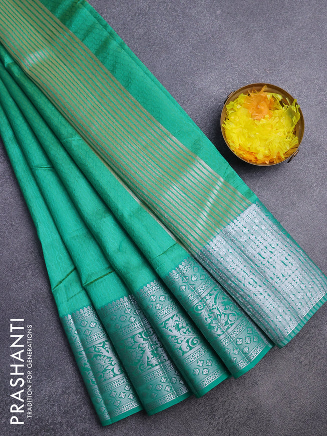 Semi raw silk saree dual shade of teal green shade with allover self emboss and long silver zari woven border