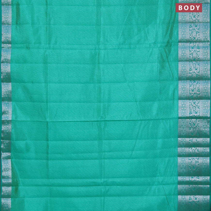 Semi raw silk saree dual shade of teal green shade with allover self emboss and long silver zari woven border