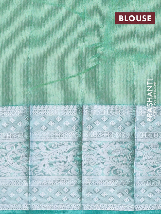 Semi raw silk saree dual shade of teal green shade with allover self emboss and long silver zari woven border