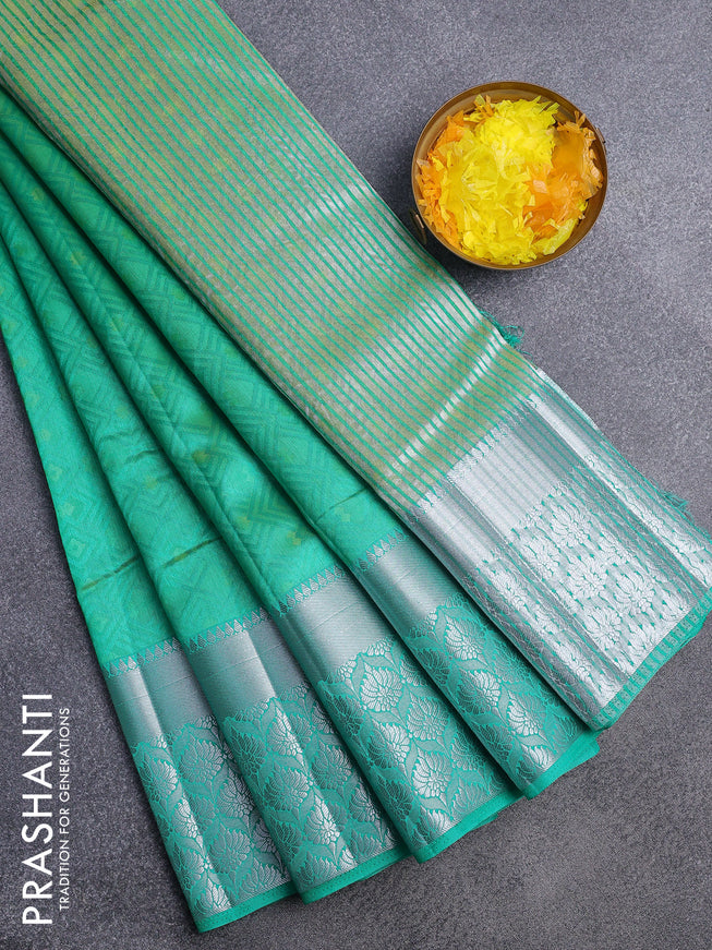 Semi raw silk saree dual shade of teal green with allover self emboss and long silver zari woven border